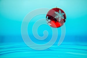 Christmas ball ornament decoration splashes in water tropical