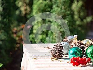 Christmas ball and pine cones on table