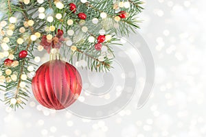 Christmas ball on shiny silver background