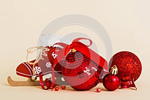 Christmas ball with skates on colored background. decoration bauble with ribbon bow with copy space