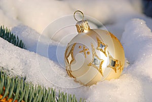 Christmas ball in snow