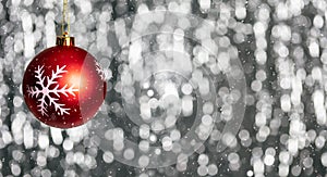 Christmas ball and snow in the night, abstract bokeh lights background, banner,