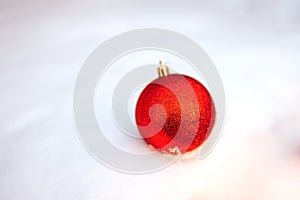Christmas ball on snow.