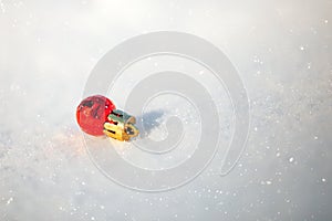 Christmas ball on snow.