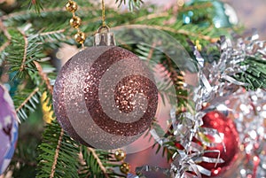 Christmas ball on the tree. Bump and Christmas tree garland