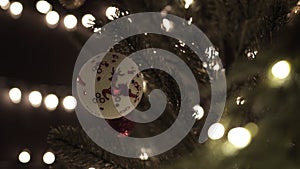 Christmas ball on tree with glow bokeh lights background