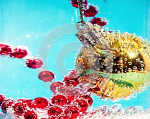 Christmas ball in water with bubbles, Christmas card concept