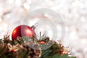 Christmas ball on wreath with light background