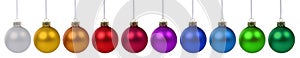 Christmas balls baubles colorful in a row isolated on white