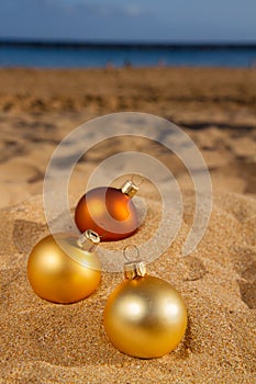 Christmas balls on beach