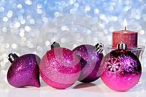 Christmas Balls and Candle on a Background