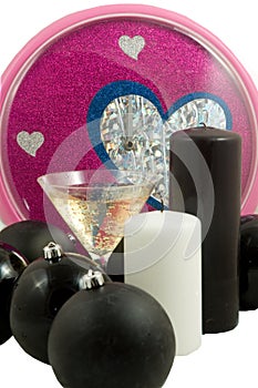 Christmas balls and champagne with colorful clock