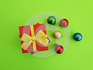 Christmas balls on a colored gift box celebrate decor season