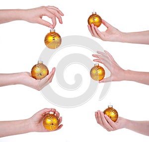 Christmas balls in a female hand, isolated
