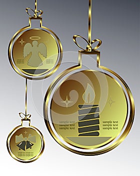 Christmas balls of gold color with symbols of a candle, an angel and bells, a set of