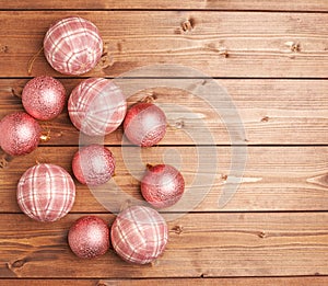 Christmas balls over the wooden background