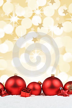 Christmas balls red decoration snow winter portrait format golden background copyspace