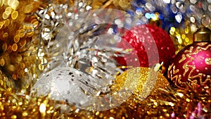 Christmas balls shiny tinsel and swirling bokeh
