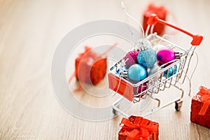 Christmas balls in shopping cart