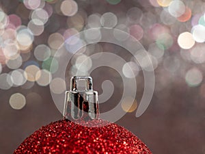 Christmas balls on a silvery background. Christmas decoration with beautiful bokeh.