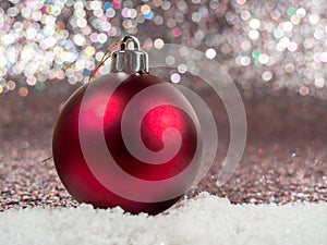 Christmas balls on a silvery background. Christmas decoration with beautiful bokeh.