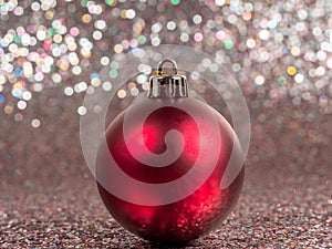 Christmas balls on a silvery background. Christmas decoration with beautiful bokeh.