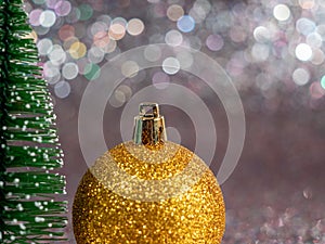 Christmas balls on a silvery background. Christmas decoration with beautiful bokeh.