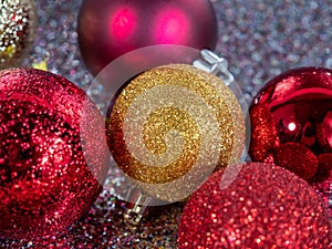 Christmas balls on a silvery background. Christmas decoration with beautiful bokeh.