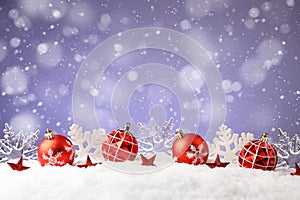 Christmas balls and snowflake with snow on color background