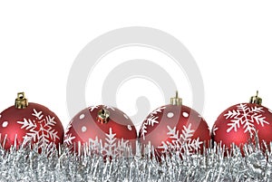 Christmas balls with snowflakes on tinsel