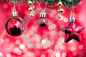 Christmas balls and star ornament decorate on fir tree with red