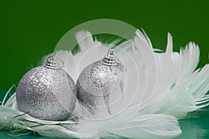 Christmas balls on white feather