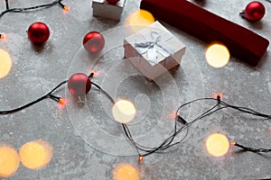 Christmas balls and white vinous gift boxes form the decoration of the Christmas tree, in the background in the form of a bokeh