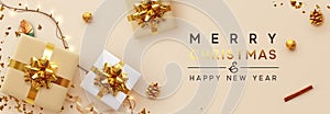 Christmas banner. Background Xmas design of sparkling lights garland, with realistic gifts box, glitter gold confetti. Horizontal