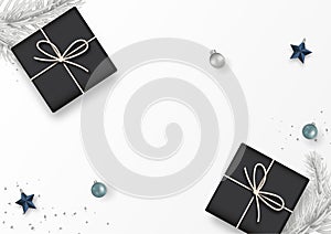 Christmas banner. Gift box decorated with gray fir tree, Christmas balls, star, confetti, top view isolated on white background.
