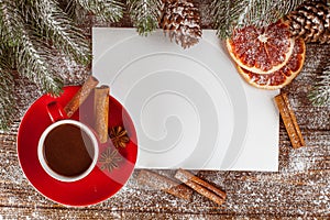 Christmas banner with green tree, cones, red cups with hot chocolate, orange and cinnamon on brown wooden background