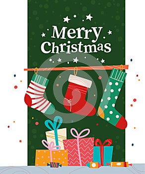 Christmas banner with pile of gift boxes, candy, Christmas stockings and text Merry Christmas greeting on green background.