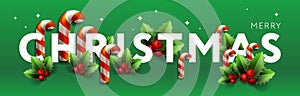 Christmas banner. Xmas Horizontal composition made of Christmas candy canes and holy berry. Christmas poster, greeting
