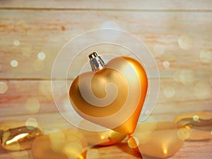 Christmas bauble. Christmas toy in the shape of a heart of gold color. Christmas. New year stock photo