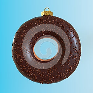 Christmas bauble decoration made of pink doughnut on blue background