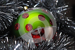 Christmas bauble nesting in silver tinsel 8