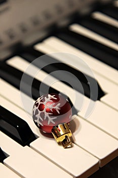 Christmas Bauble on Piano Keys photo