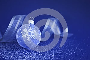 Christmas Bauble and Ribbon on Snow