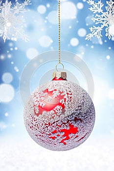 Christmas bauble on a snowy winter background, Merry Christmas and Happy Holidays wishes, generative ai