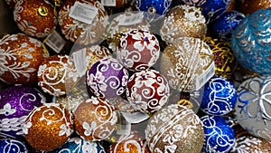 Christmas baubles decoration on bright background. lay in store. Holiday concept. Wide