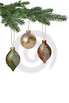 Christmas baubles hanging on pine tree