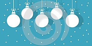 Christmas baubles hanging white ornaments on blue snowing winter background