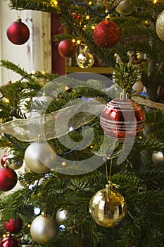 Christmas Baubles on a illuminated Christmas tree