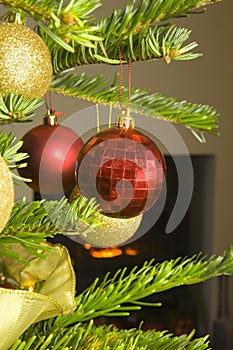 Christmas Baubles on a illuminated Christmas tree