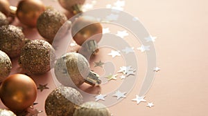 Christmas baubles over pink backgroud with star shaped glitter. Baner